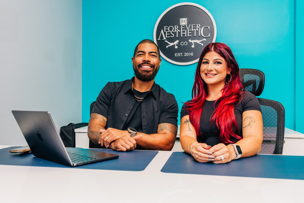 Michael and Lisa Hinson, owners of Forever Aesthetic, in their studio office